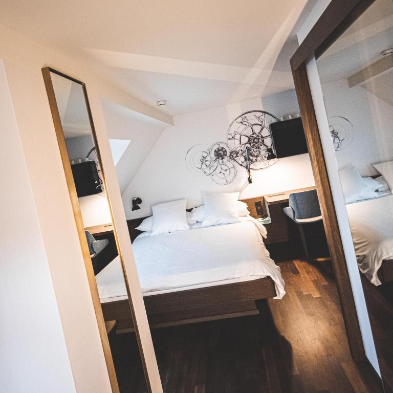 Posteľ alebo postele v izbe v ubytovaní Hotel Bernina Geneva