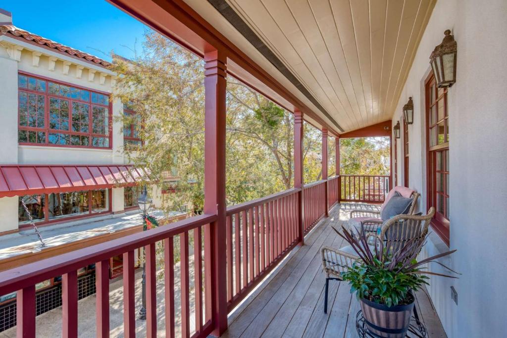 a porch with a chair and a plant at 110 St. George Street in St. Augustine