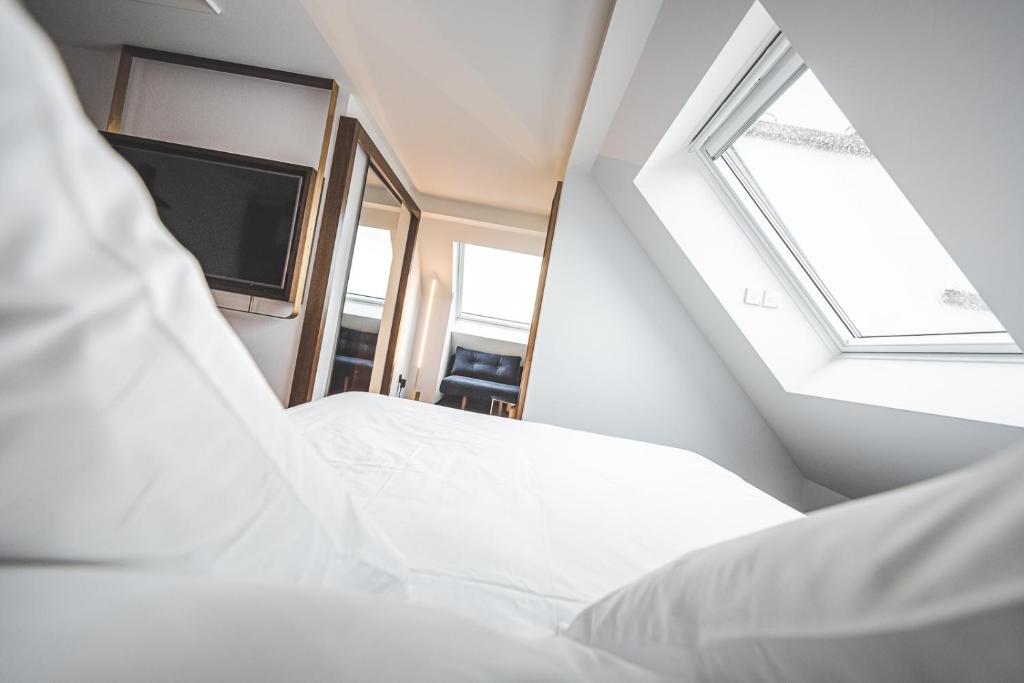 Posteľ alebo postele v izbe v ubytovaní Hotel Bernina Geneva