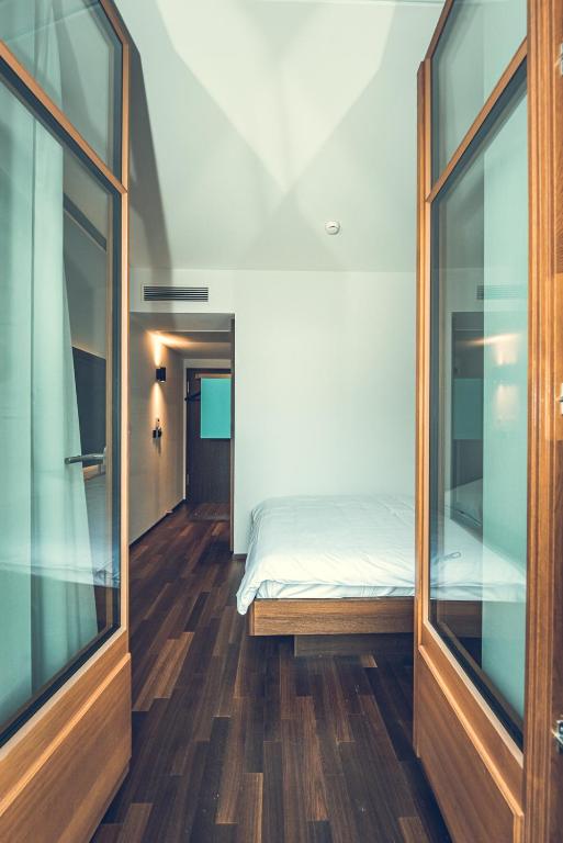 Posteľ alebo postele v izbe v ubytovaní Hotel Bernina Geneva