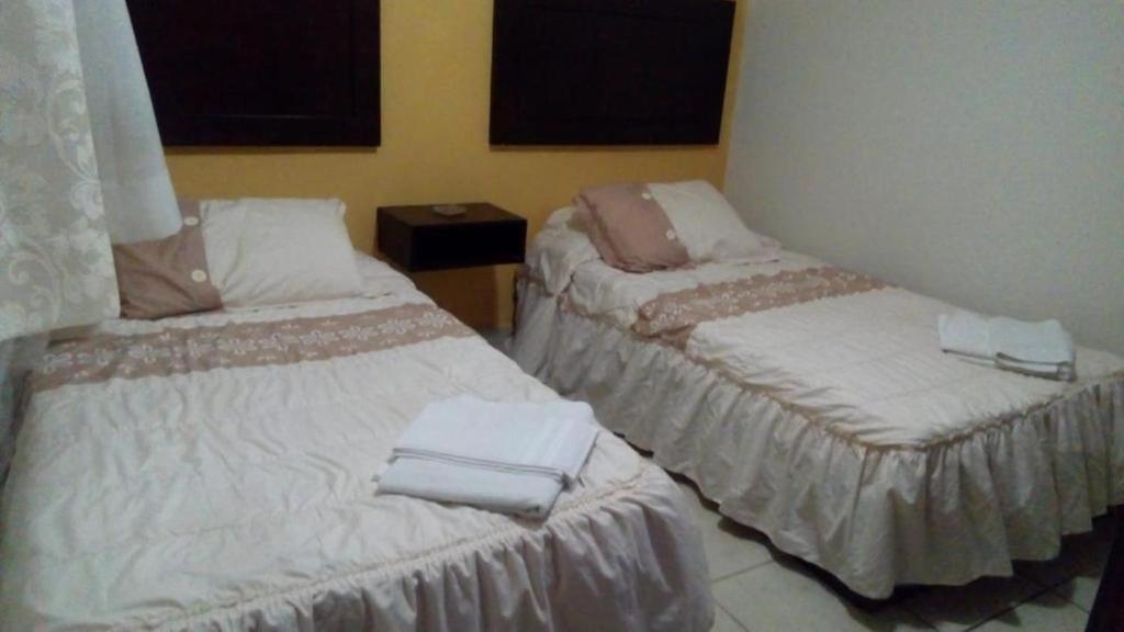 Cama o camas de una habitación en Hotel Posada San Juan