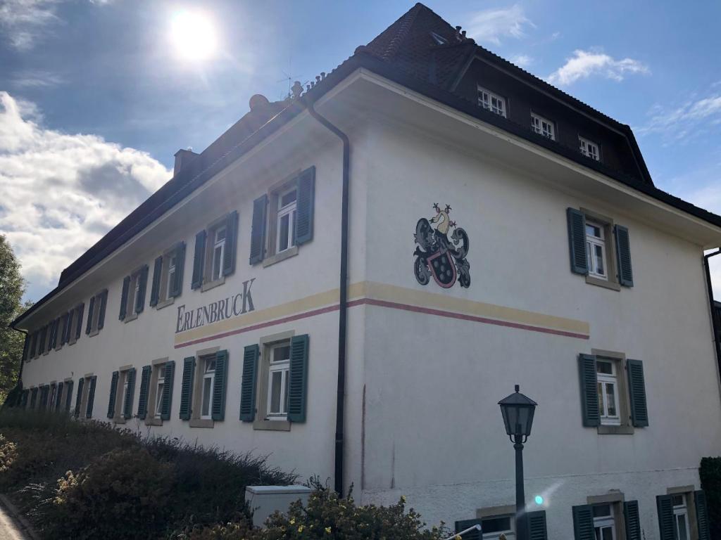 a white building with a motorcycle on the side of it at Ferienwohnung Hochschwarzwald in Hinterzarten