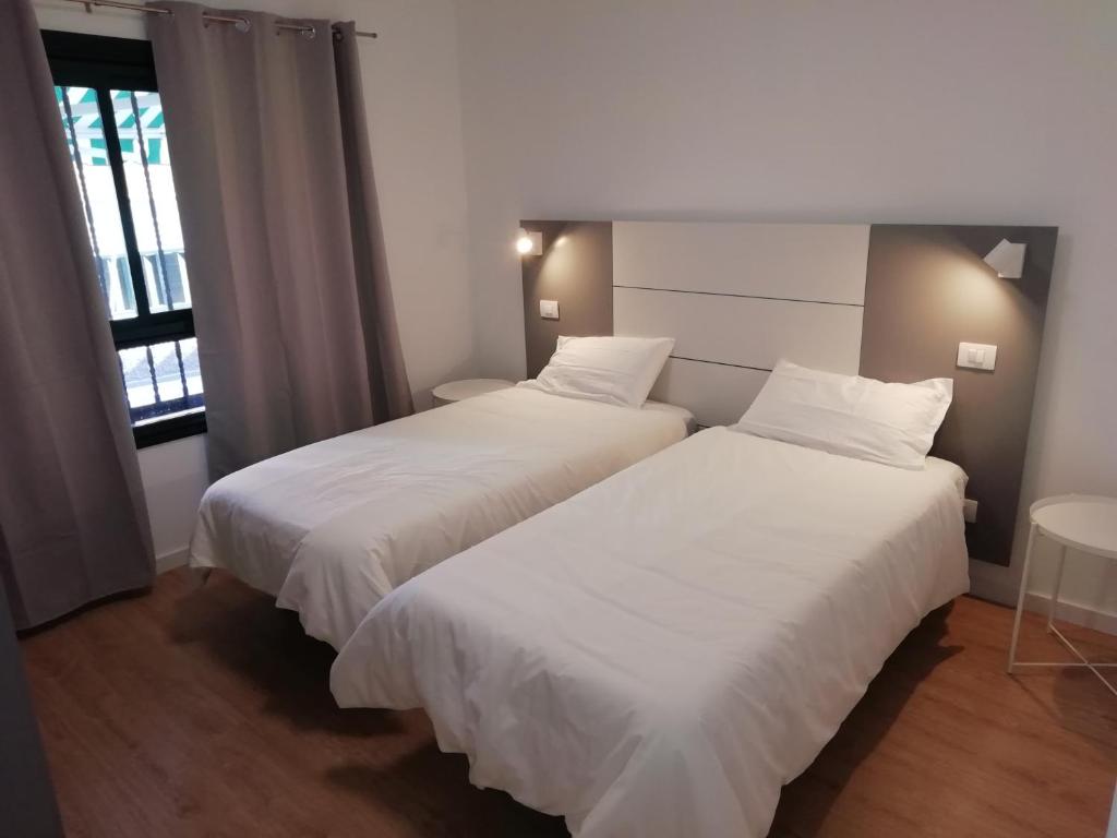 Postel nebo postele na pokoji v ubytování CASA ANA PUERTITO DE GUIMAR