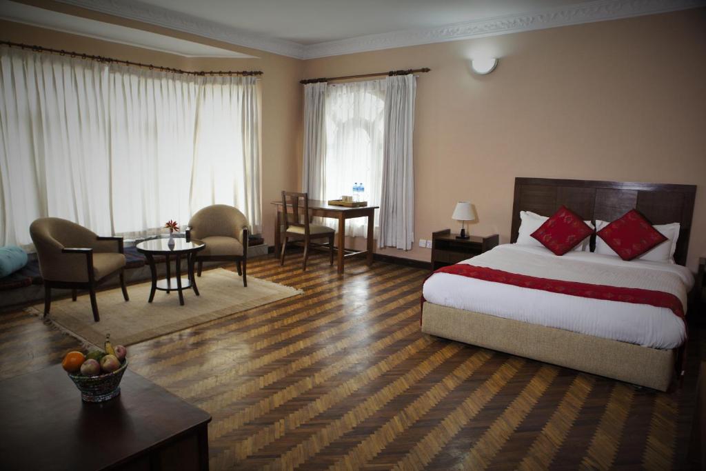 Postel nebo postele na pokoji v ubytování ROKPA Guest House