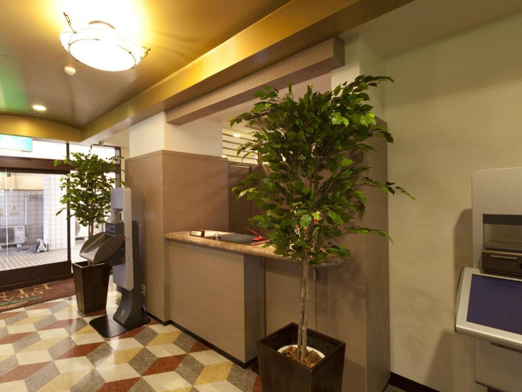 TV a/nebo společenská místnost v ubytování Hotel Grand Fine Toyonaka Minami