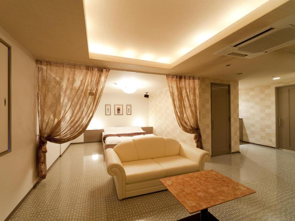 Postel nebo postele na pokoji v ubytování Hotel Grand Fine Toyonaka Minami
