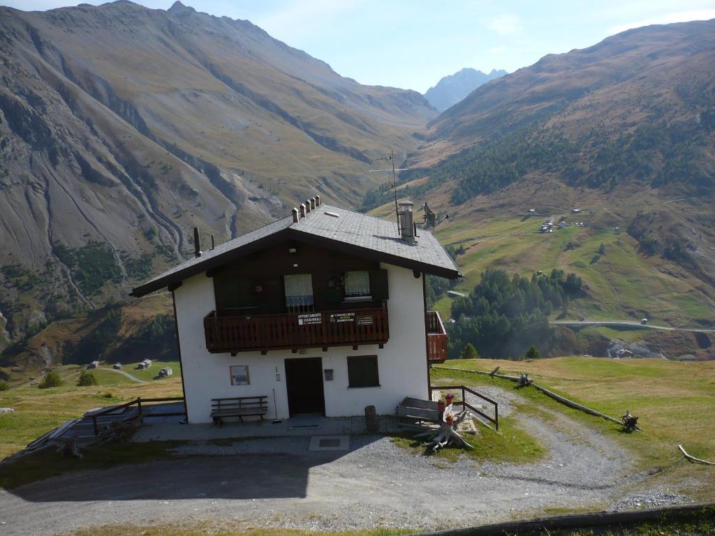 a small building on top of a mountain at Casa Gembre in Livigno