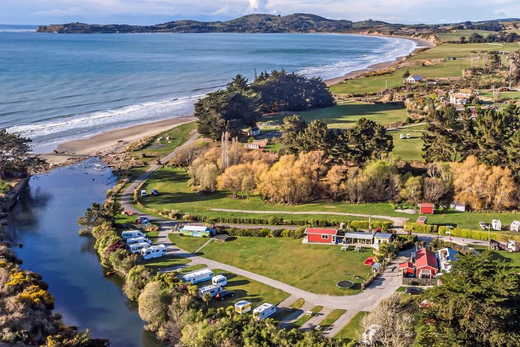 an aerial view of a camping area next to a beach at Moeraki Boulders Holiday Park & Motel in Hampden