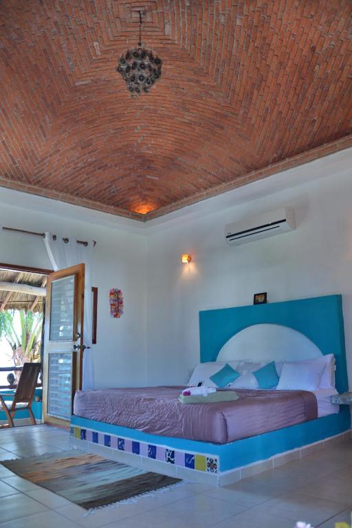 Postel nebo postele na pokoji v ubytování Nacional Beach Club & Bungalows