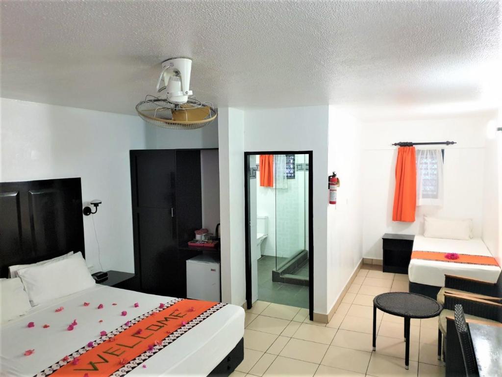 Postel nebo postele na pokoji v ubytování Suva Motor Inn