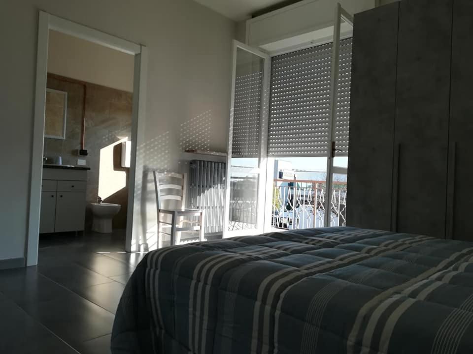 Postel nebo postele na pokoji v ubytování LE MURA Foresteria