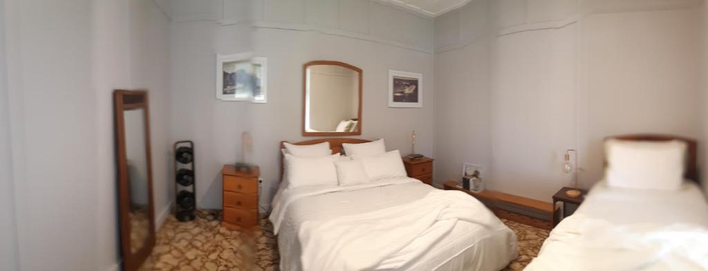 Postel nebo postele na pokoji v ubytování Sunseeker Lodge