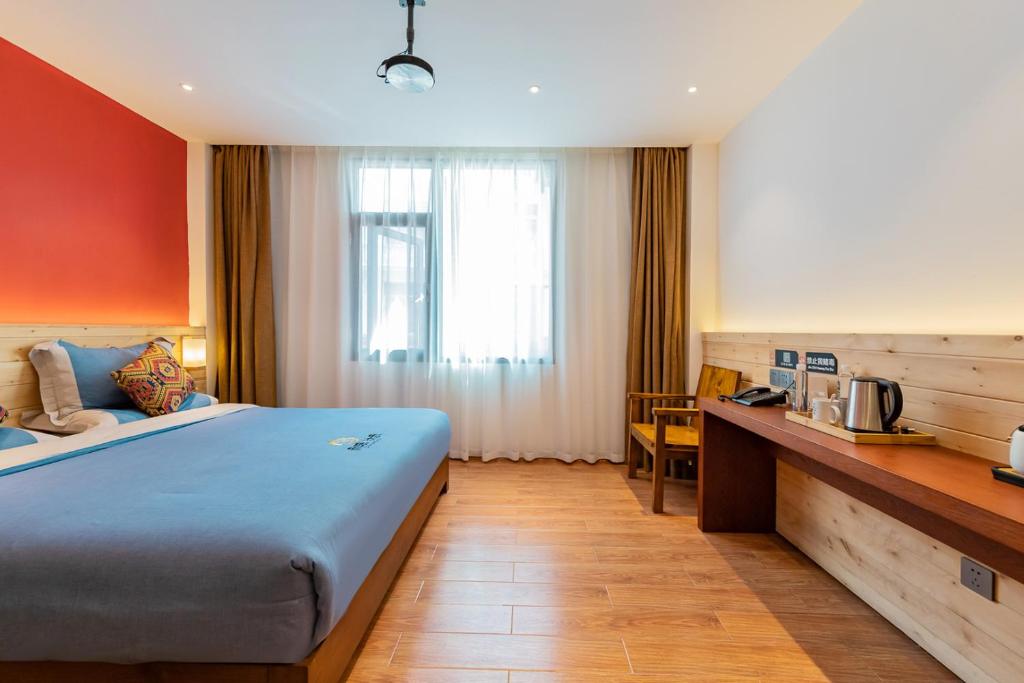 Postel nebo postele na pokoji v ubytování Enshi Grand Canyon Yutan Muyun Guesthouse