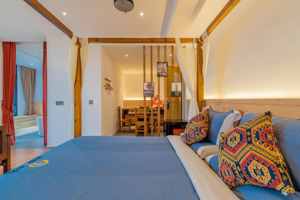 Postel nebo postele na pokoji v ubytování Enshi Grand Canyon Yutan Muyun Guesthouse