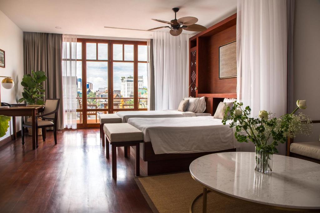 Postel nebo postele na pokoji v ubytování Amanjaya Pancam Suites Hotel