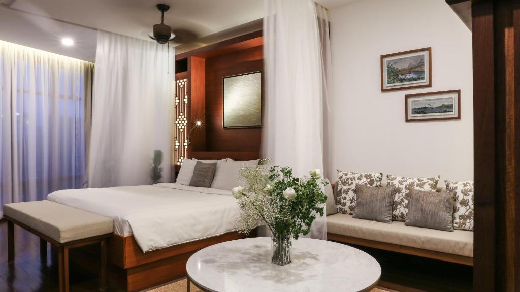 Postel nebo postele na pokoji v ubytování Amanjaya Pancam Suites Hotel