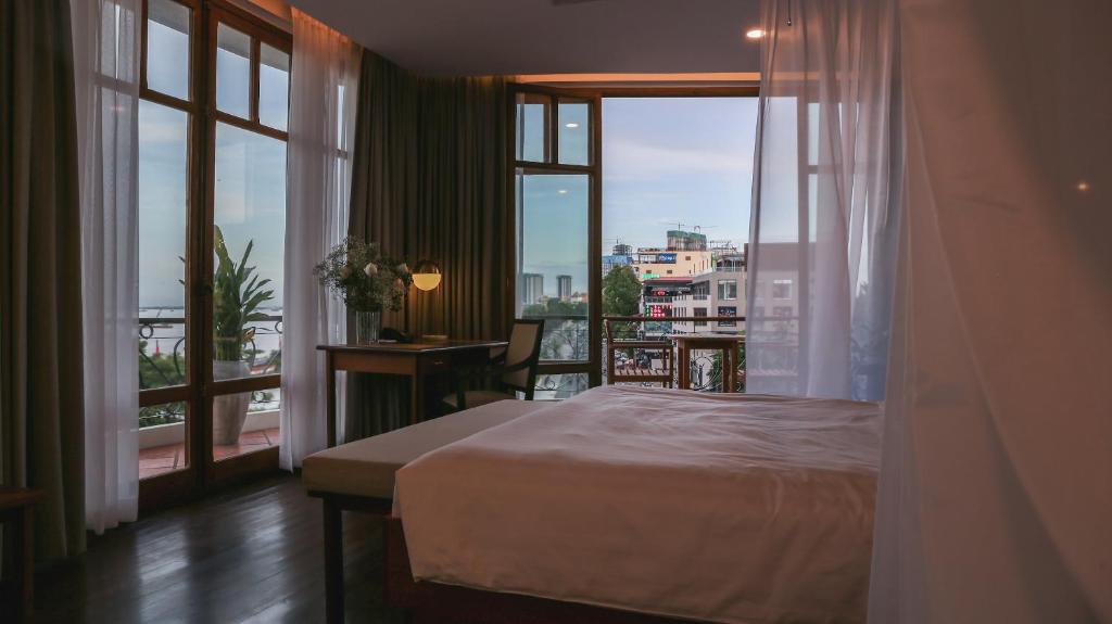 Postel nebo postele na pokoji v ubytování Amanjaya Pancam Suites Hotel