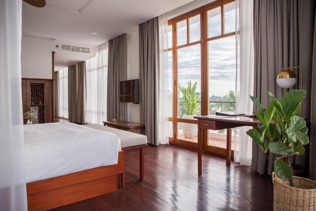 Postel nebo postele na pokoji v ubytování Amanjaya Pancam Suites Hotel