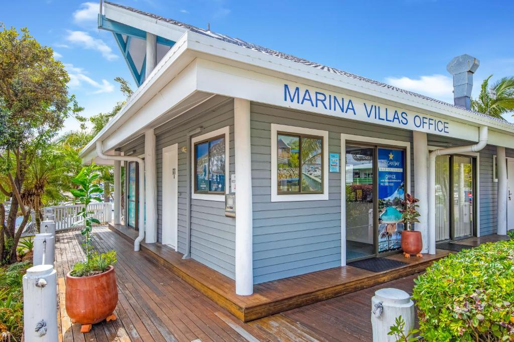 a marina villas office on a wooden deck at Tin Can Bay Marina Villas in Tin Can Bay