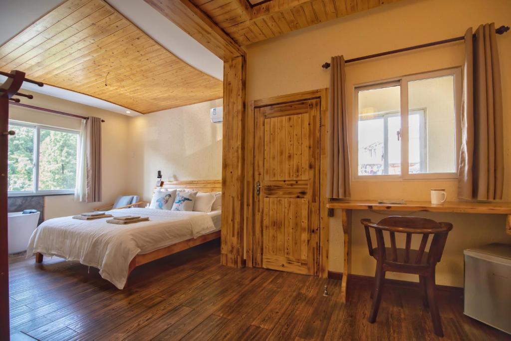 Postel nebo postele na pokoji v ubytování Moganshan Bamboo View Guesthouse