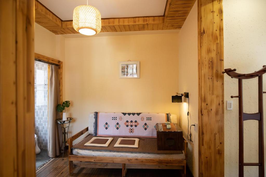 Postel nebo postele na pokoji v ubytování Moganshan Bamboo View Guesthouse