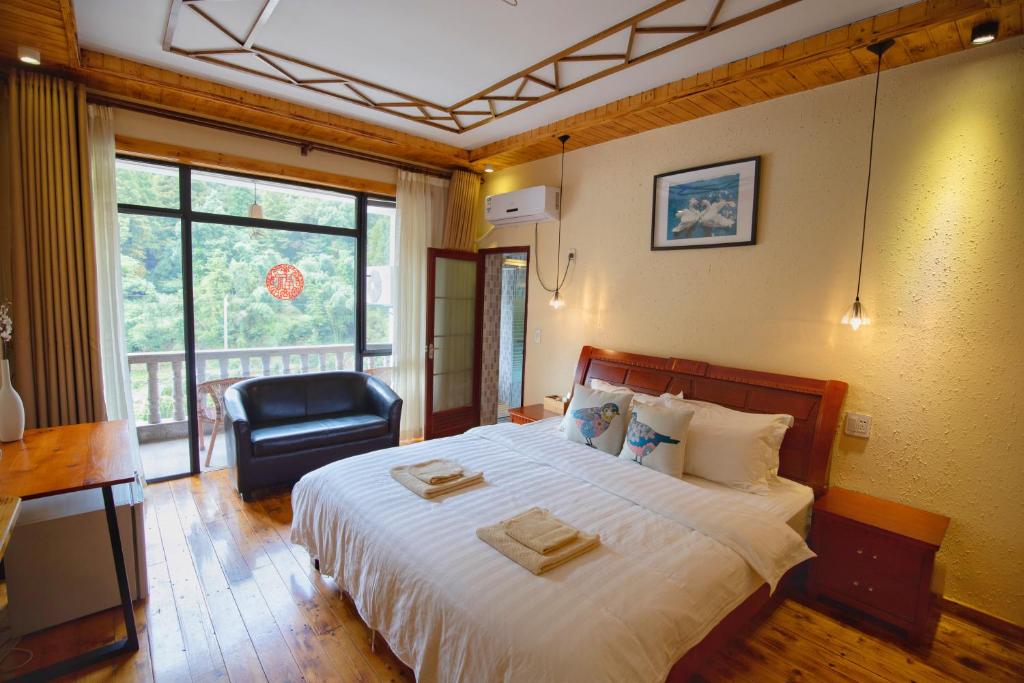 Postel nebo postele na pokoji v ubytování Moganshan Bamboo View Guesthouse
