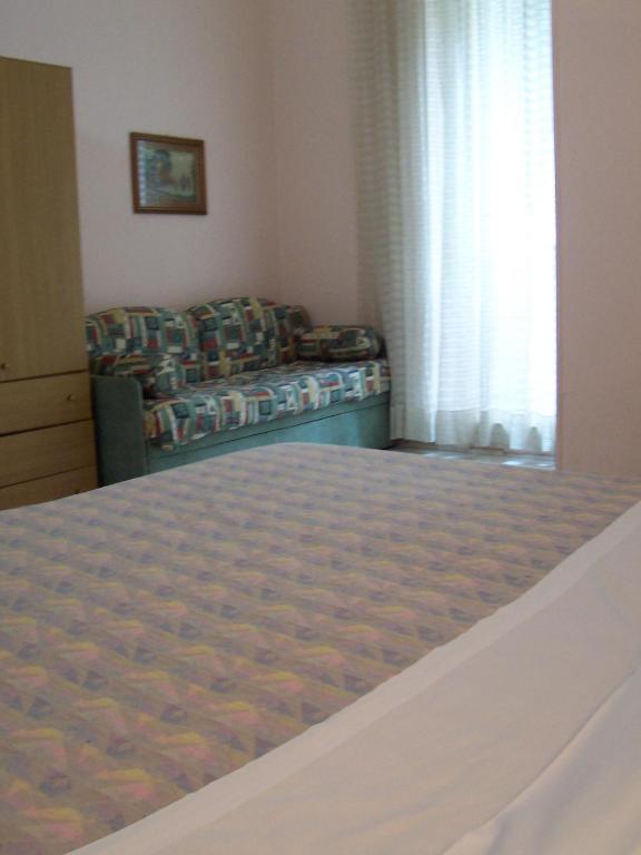 Postel nebo postele na pokoji v ubytování Hotel Pensione Romeo