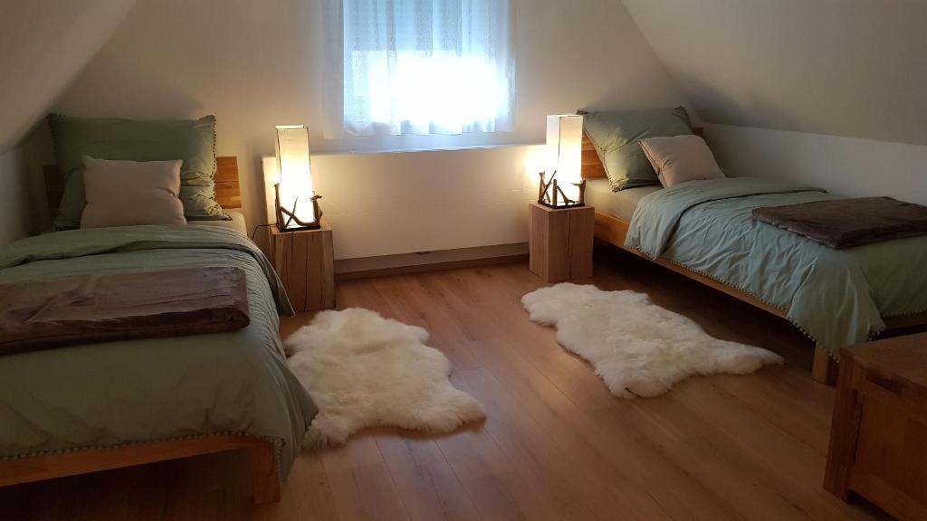 A bed or beds in a room at Gästehaus Sabine