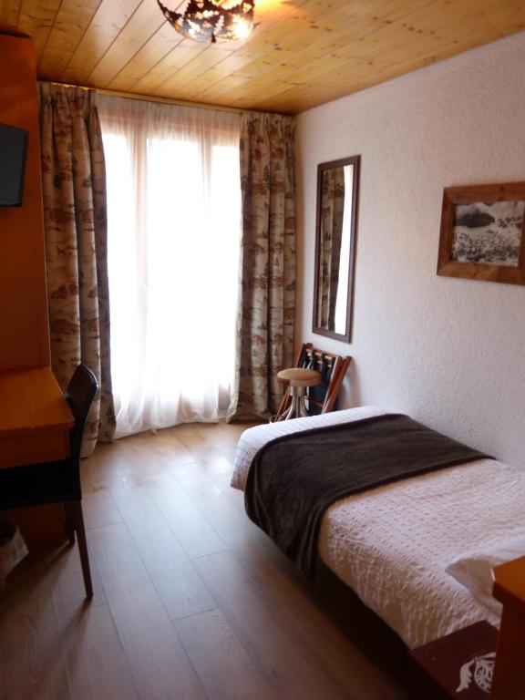 Postel nebo postele na pokoji v ubytování Hotel Ermitage Verbier