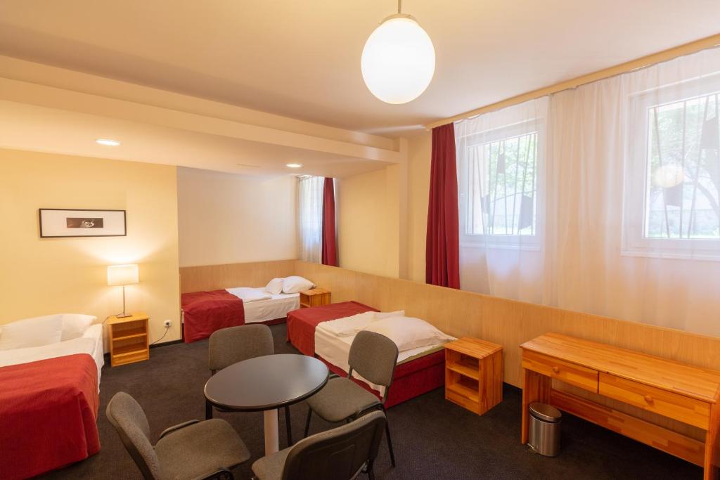 Postel nebo postele na pokoji v ubytování Hotel Laterum