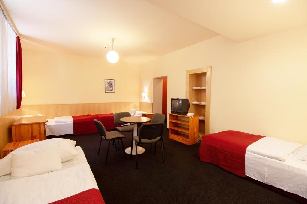 Postel nebo postele na pokoji v ubytování Hotel Laterum