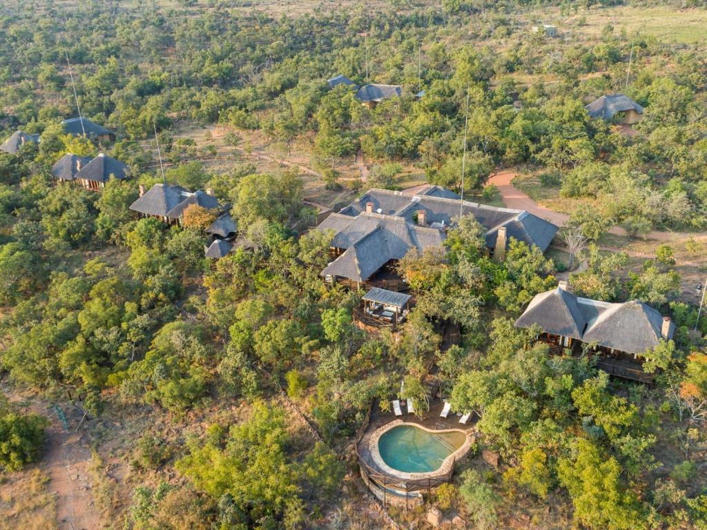 an aerial view of a house with a pool and trees at Tintswalo Waterberg in Vaalwater