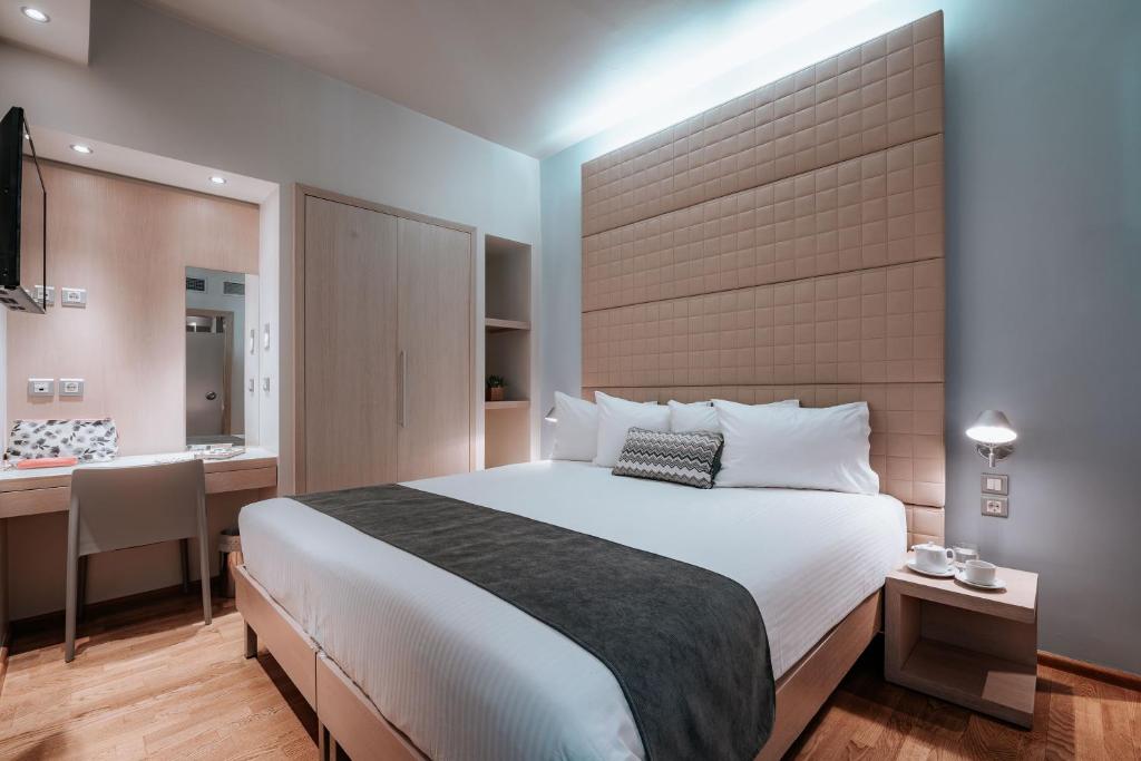 Postel nebo postele na pokoji v ubytování Domotel Olympia