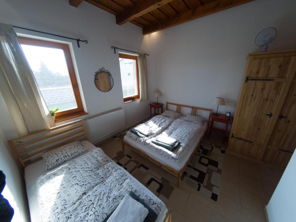 Postel nebo postele na pokoji v ubytování Kun Pista Vendégház