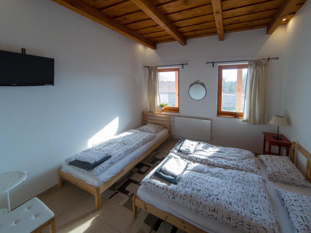 Postel nebo postele na pokoji v ubytování Kun Pista Vendégház