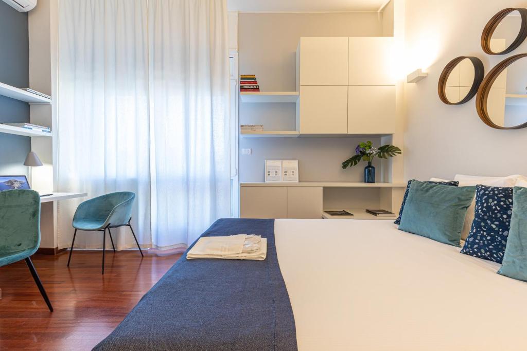 Posteľ alebo postele v izbe v ubytovaní BePlace Garibaldi Suites