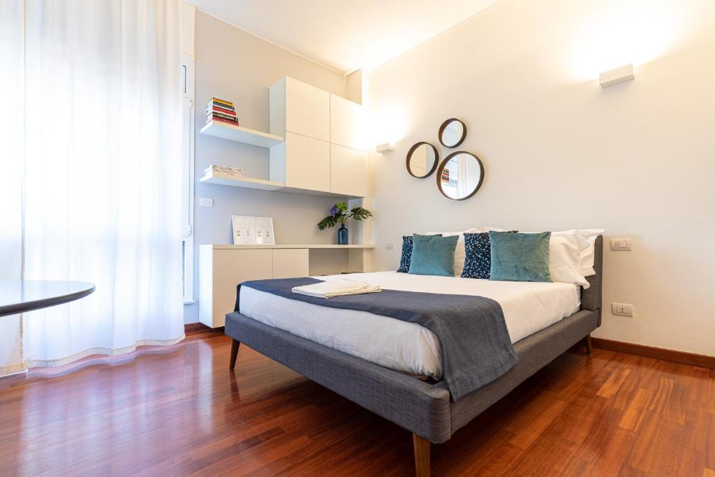 Posteľ alebo postele v izbe v ubytovaní BePlace Garibaldi Suites