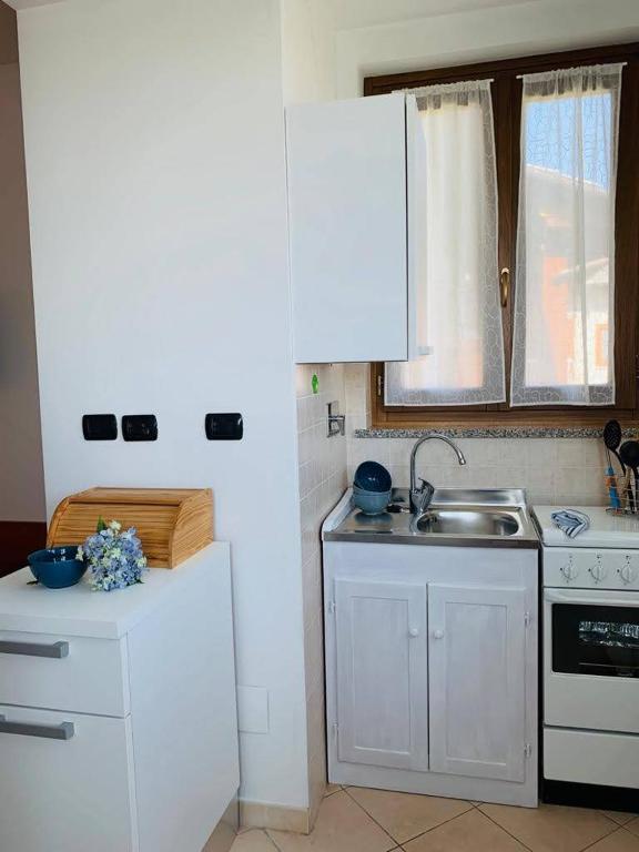 Kuchyň nebo kuchyňský kout v ubytování Casa Vacanze Orchidea
