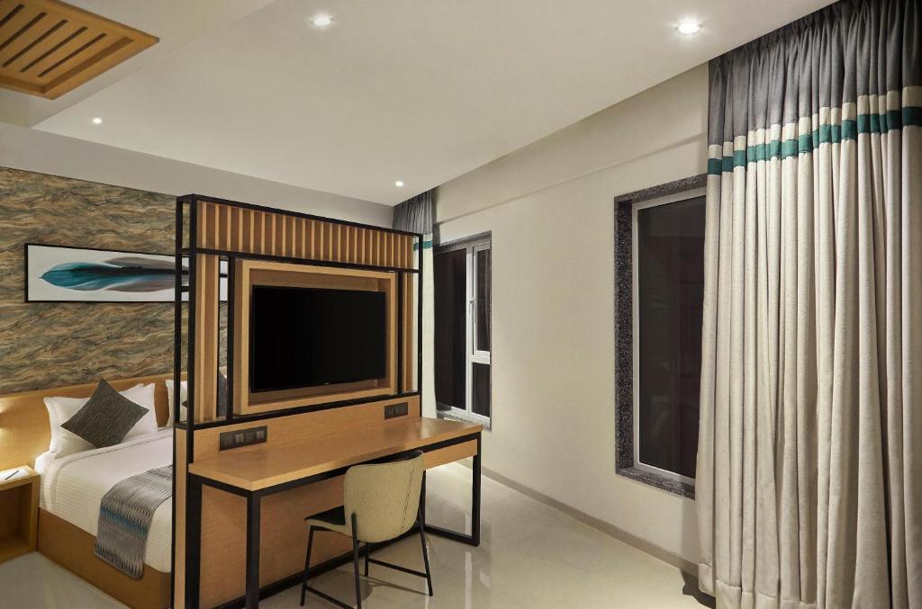 Postel nebo postele na pokoji v ubytování Click Hotel Bangalore - International Airport