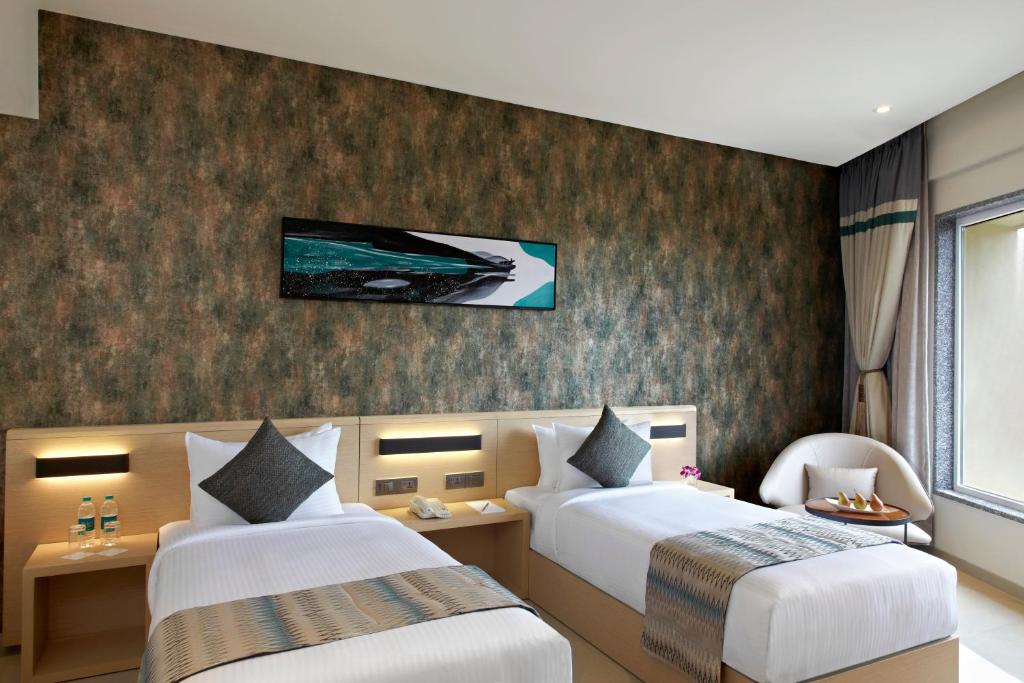 Postel nebo postele na pokoji v ubytování Click Hotel Bangalore - International Airport