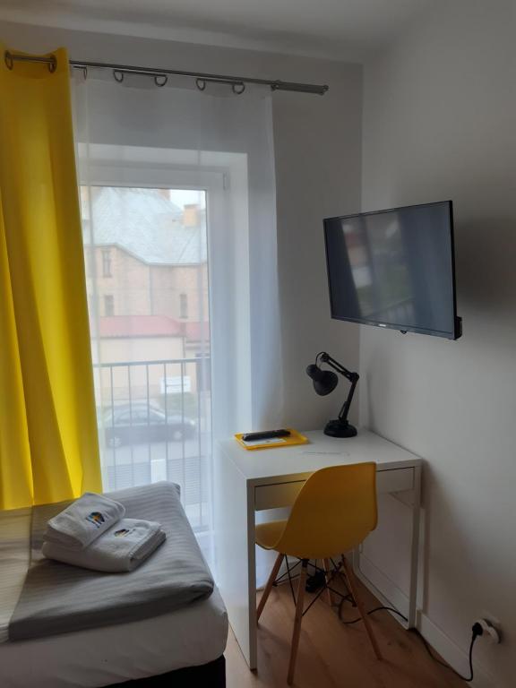 Televízia a/alebo spoločenská miestnosť v ubytovaní SZWEDZKA22 PL Premium Rooms