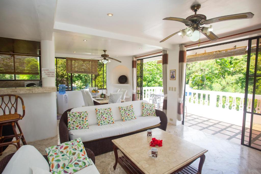 a living room with a couch and a table at Franky Villa in Boracay