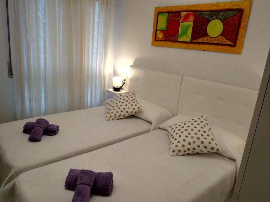 Postel nebo postele na pokoji v ubytování CASA DANIELA II