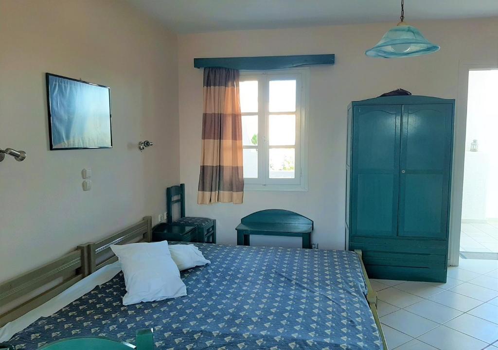 Postel nebo postele na pokoji v ubytování Joanna's Rooms on the Beach
