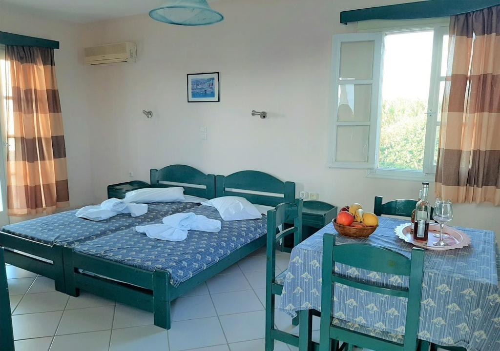 Postel nebo postele na pokoji v ubytování Joanna's Rooms on the Beach