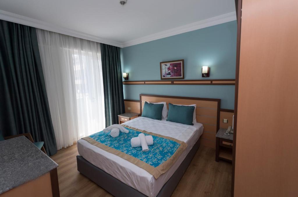 Postel nebo postele na pokoji v ubytování Side Village Family Suite - All Inclusive
