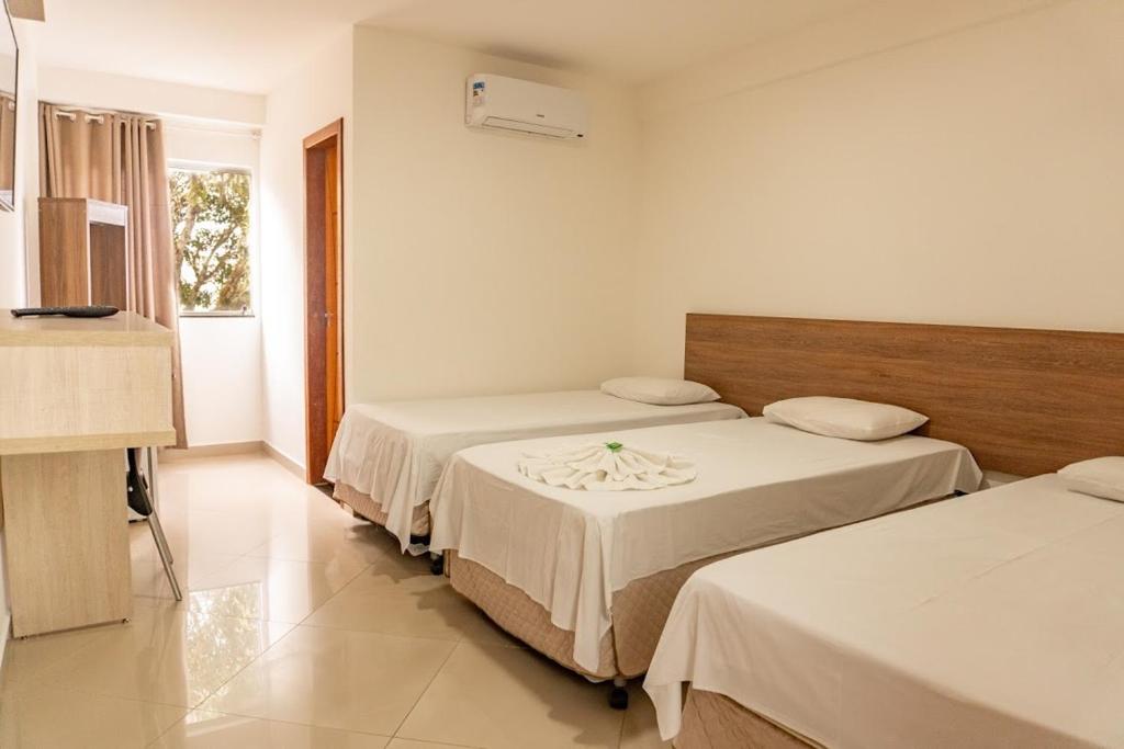 Ένα ή περισσότερα κρεβάτια σε δωμάτιο στο Hotel Skalla