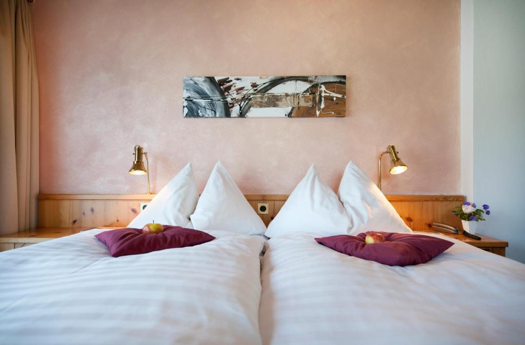 Postel nebo postele na pokoji v ubytování T3 Hotel Mira Val