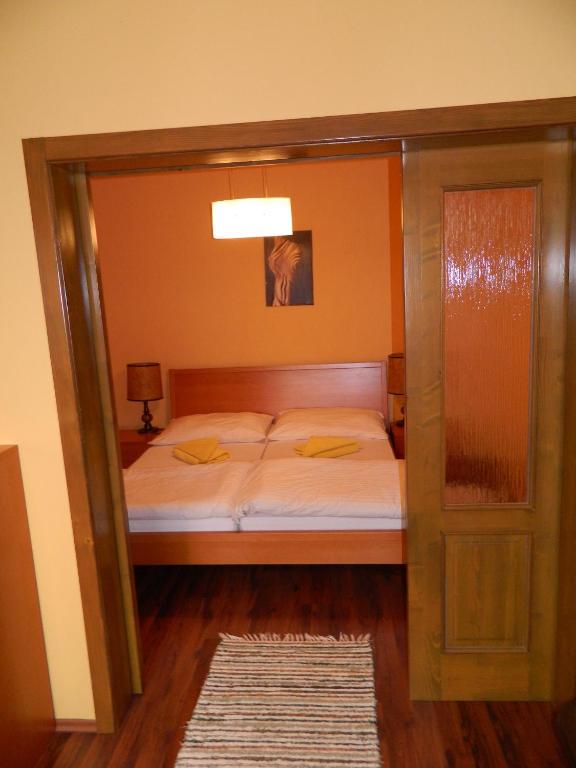 A bed or beds in a room at Hotel Slnecny Dvor
