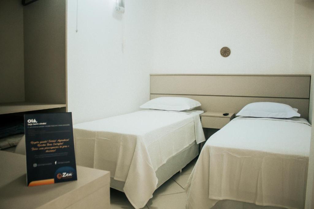 Postel nebo postele na pokoji v ubytování Zen Pousada